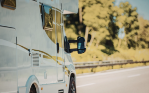 RV driving on highway for summer road trip
